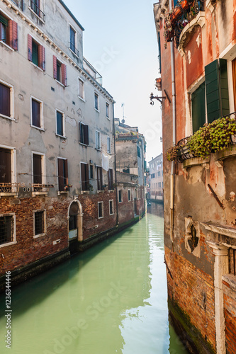 Old venetian architecture on the canal in Venice, Italy.
