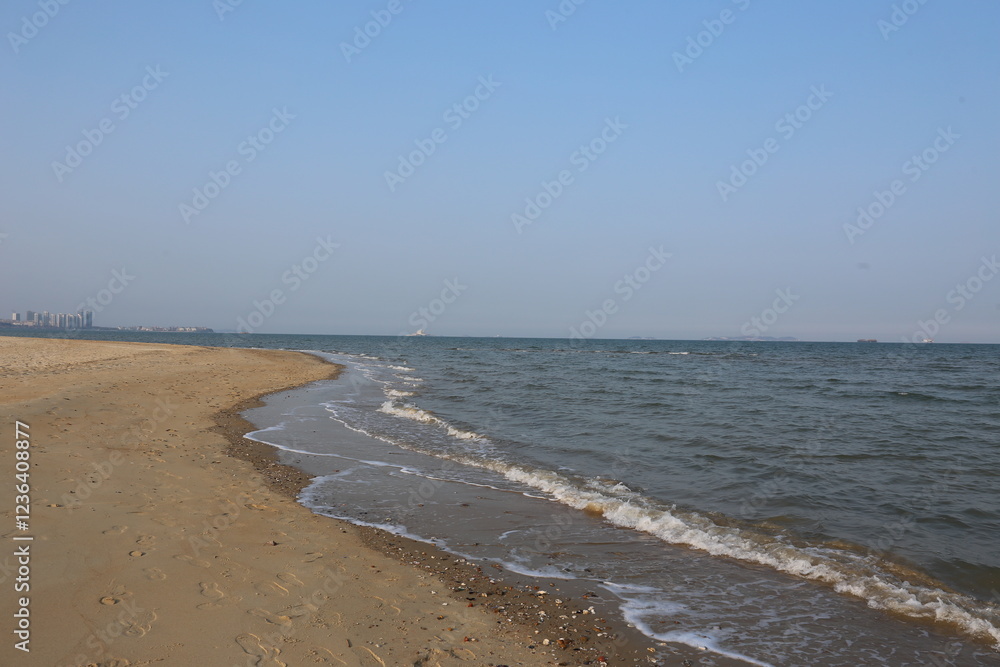 Serene Yantai Seascape: Seagulls, Rocky Coast, and Empty Sandy Beach Serene Yantai Seascape: Seagulls, Rocky Coast, and Empty Sandy Beach