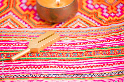 tuning fork on a fabric.