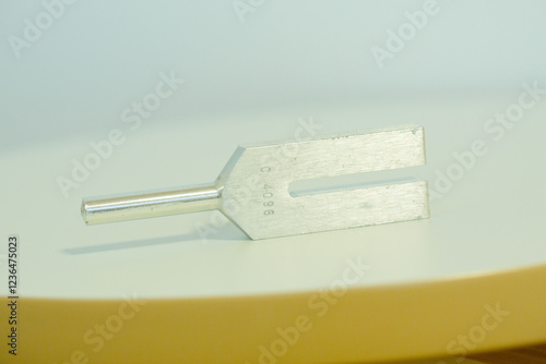 tuning fork on a fabric.