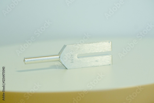 tuning fork on a fabric.
