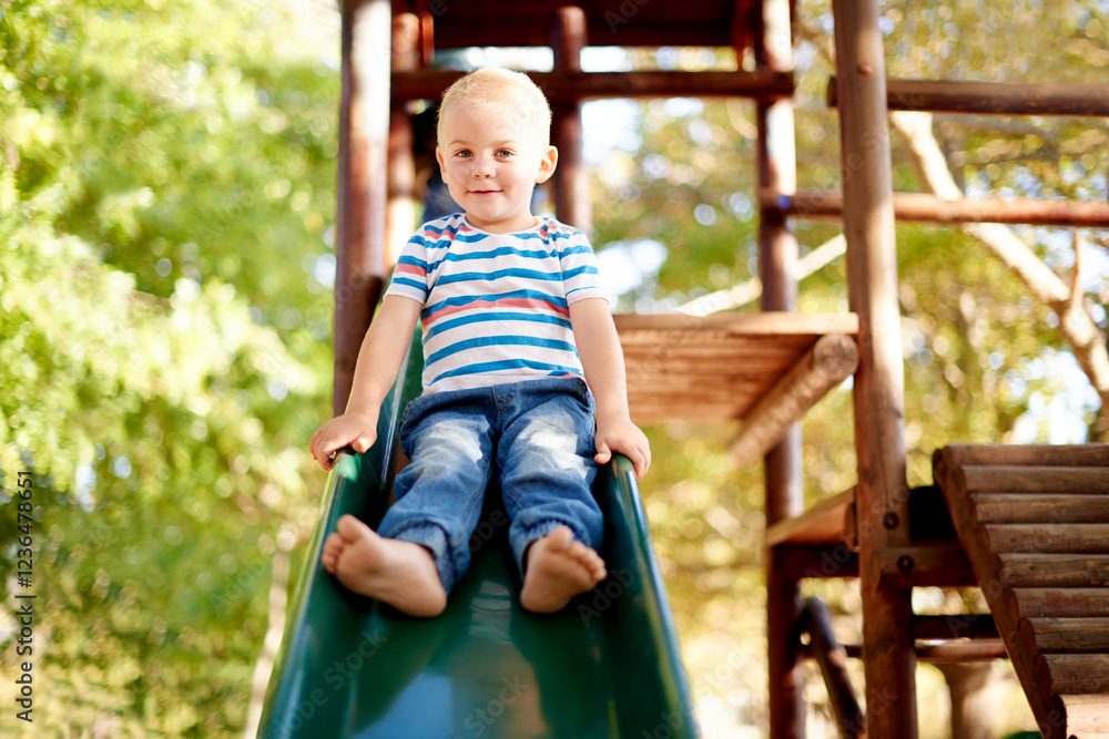 Happy, playing and portrait of child on slide in park for physical skills, confidence or fun. Exploring, nature and boy kid on playground equipment for adventure, hobby or cognitive development. Happy, playing and portrait of child on slide in park for physical skills, confidence or fun. Exploring, nature and boy kid on playground equipment for adventure, hobby or cognitive development.