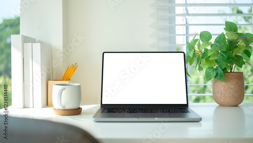 Wallpaper Mural White desk with a laptop, coffee mug, green potted plant and books. Torontodigital.ca