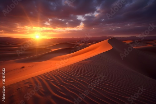 Desert Sandscapes: Witnessing a Fiery Sunset over Rolling Dunes, Golden Hour Hues Paint the Landscape with Dramatic Shadows, Creating a Breathtaking Vista of Nature's Majesty photo