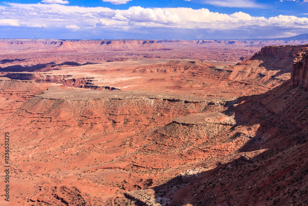 A desert landscape with a mountain in the background A desert landscape with a mountain in the background
