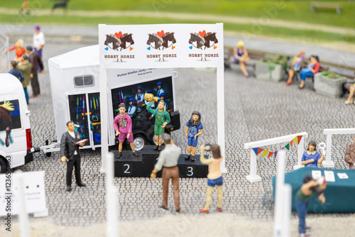 Obraz na plátně miniature hobby horse competition with podium and cheering participants in color