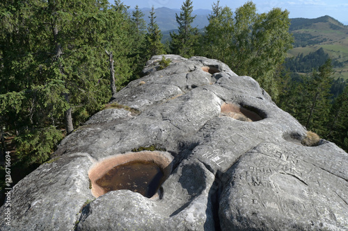 Pysanyj kamin (Written stone) in green forest at Carpathian mountains. Ukraine. photo