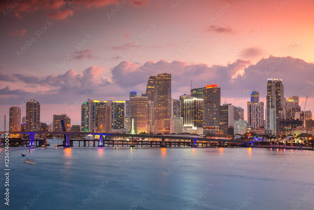 Miami, Florida, USA. Cityscape image of Miami, Florida with reflection of the city skyline in the water at beautiful sunset.