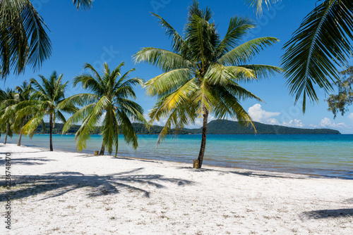 Tropical paradise beach with palm trees and turquoise water in Koh Rong Samloem, Cambodia