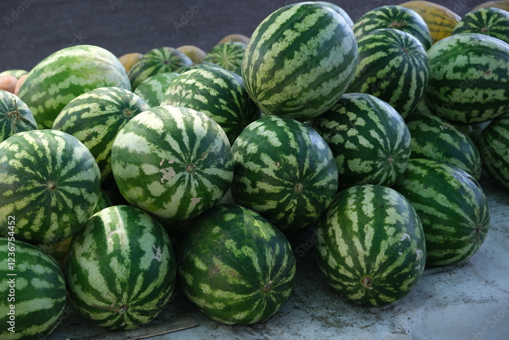a lot of striped green watermelons at the market a lot of striped green watermelons at the market