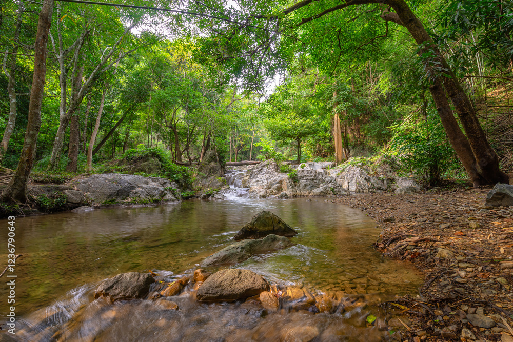 Fototapeta premium Namtok Lan Sang: Tak’s Majestic Waterfall Escape