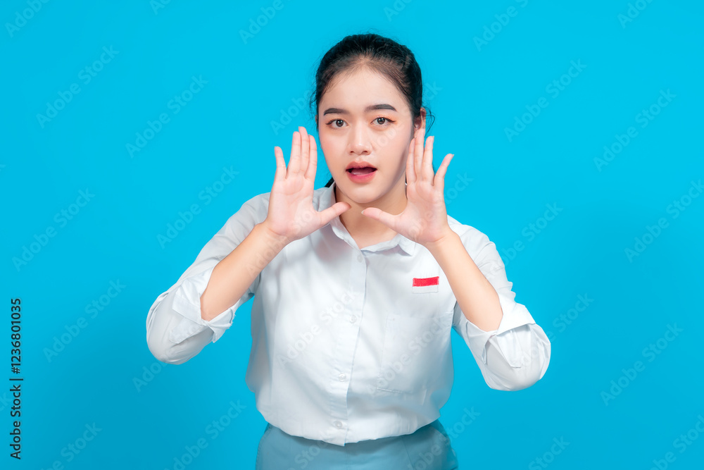 Portrait female student making an enthusiastic gesture with her hands Portrait female student making an enthusiastic gesture with her hands