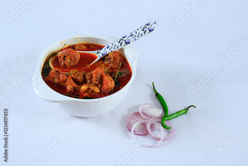 Tasty chicken curry in a bowl