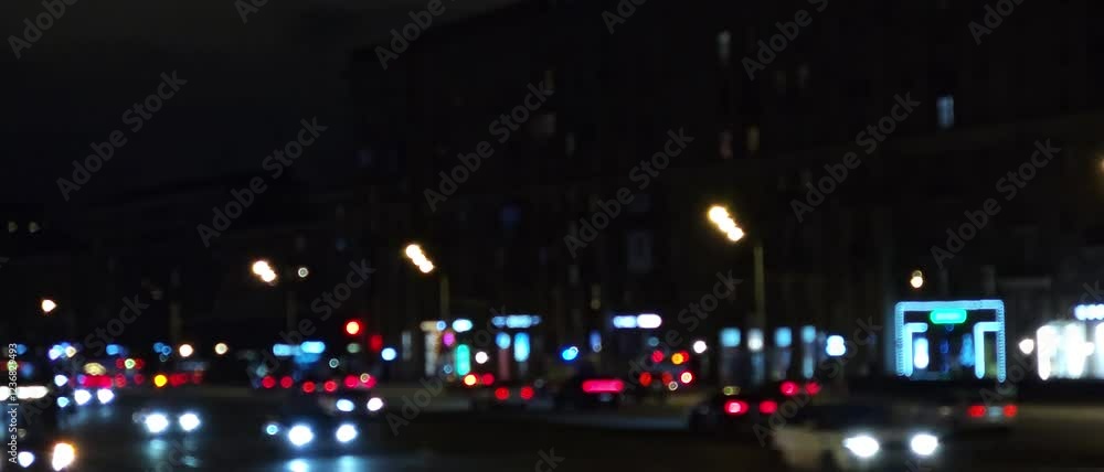 Nighttime city traffic with glowing streetlights and moving vehicles. A vibrant urban scene showcasing the energy of a busy city at night