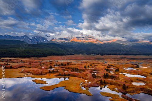 Beautiful aerial view autumn landscape photo of Dzhangyskol lake in Eshtykel plateau background mountains, Altai Republic, Russia. photo