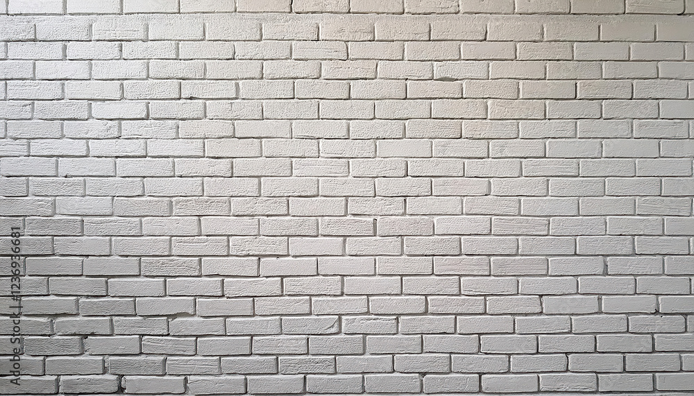 Naklejka premium textured white brick wall, slightly weathered, creates clean backdrop