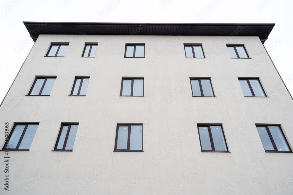 Obraz premium An imperfect simple house with different windows