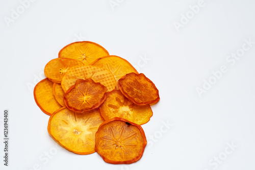 Slices, snacks, dried persimmon chips. Fruit snacks, healthy snack, vegetarian food, selective focus, close-up