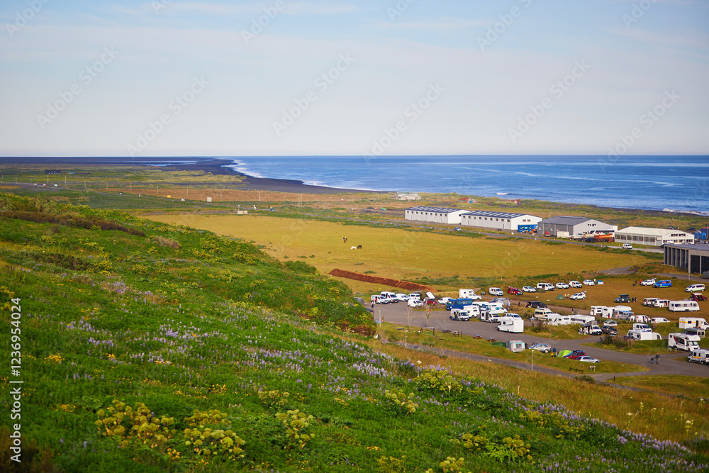 Scenic view of Vik village with ocean coast in Southern Iceland. Scenic view of Vik village with ocean coast in Southern Iceland.