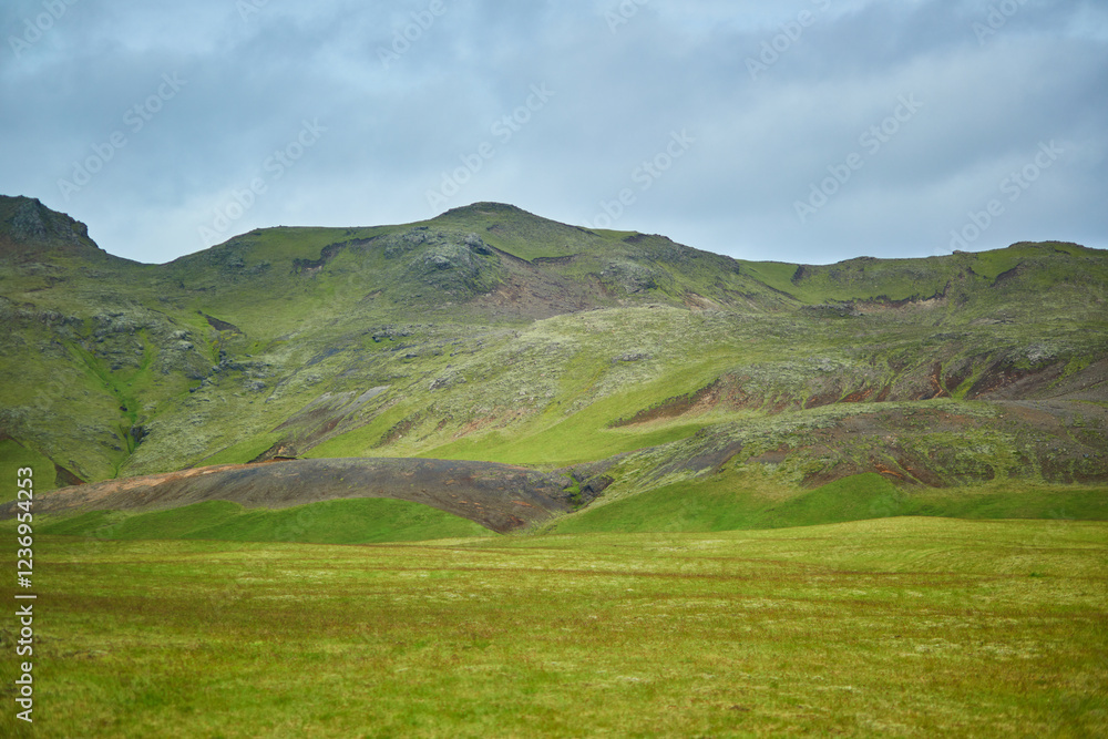 Beautiful nature landscape with green fields and majestic cliffs with ice and snow in Southern Iceland. Beautiful nature landscape with green fields and majestic cliffs with ice and snow in Southern Iceland.