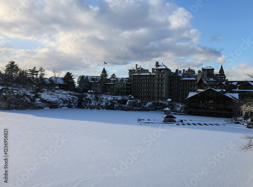 sunset view of famous hotel and wooden gazebo along hiking trail in upstate new york near new paltz (shawangunk mountain) winter snow house mohonk preserve frozen lake hike blizzard photo