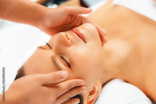 Wallpaper Mural Closeup woman enjoying relaxing anti-stress head massage and pampering facial beauty skin recreation leisure in dayspa modern light ambient at luxury resort or hotel spa salon. Quiescent Torontodigital.ca