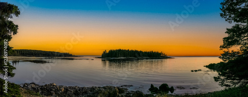 Sunset on the rugged, rocky coast of Schoodic peninsula in Acadia National Park in Maine USA photo