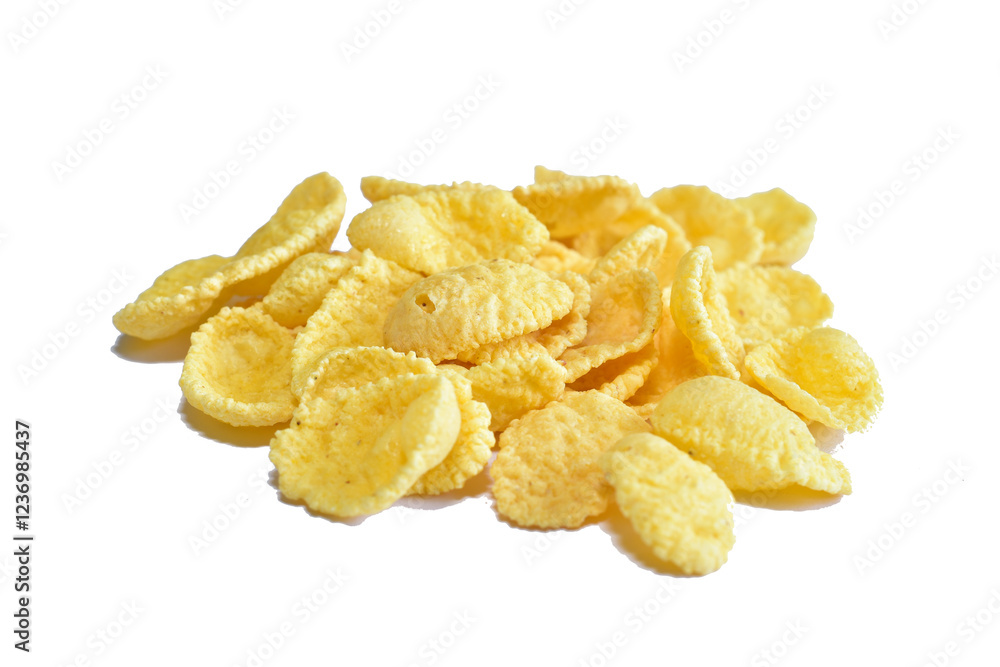 Cornflakes for breakfast lie on a white background. Cornflakes for breakfast lie on a white background.