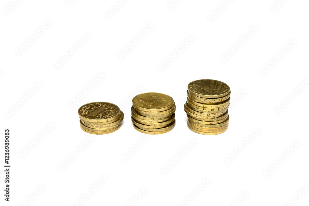 Coins arranged in stacks showing various denominations and values Coins arranged in stacks showing various denominations and values