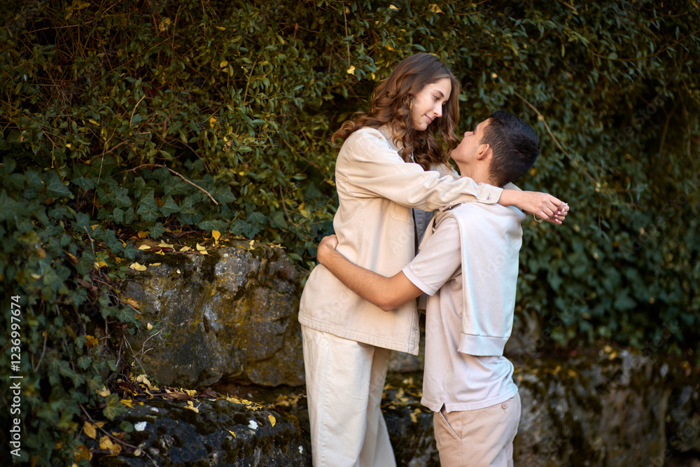Embracing Teen Love in the Greenery of the Park. Embracing Teen Love in the Greenery of the Park.