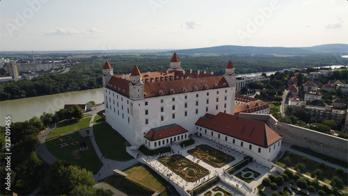Canvas Print Bratislava castle surrounded by greenery and cityscape in slovakia on a sunny da