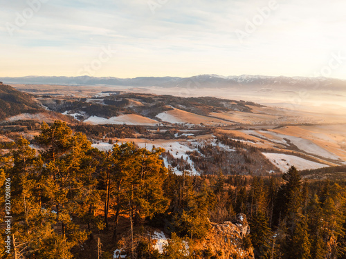 Sunset over Liptov region in the backround with Liptovska mara lake and Tatras mountains around. Liptovsky mikulas landspace, slovakia. photo