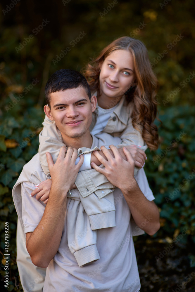 Embracing Teen Love in the Greenery of the Park. Whispers of Love: Teen Couple's Outdoor Embrace in the Park. Embracing Teen Love in the Greenery of the Park. Whispers of Love: Teen Couple's Outdoor Embrace in the Park.