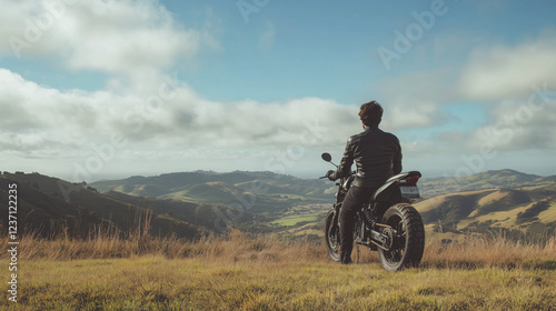 Biker Resting at a Scenic Viewpoint Overlooking a Vast Valley  Surrounded by Rolling Hills and a Tranquil Sky Creating a Peaceful Atmosphere