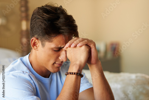 Man, prayer hands and faith in bedroom, home and repent with worship, forgiveness and eyes closed. Person, religion and connection with God, holy spirit and guide for peace, hope and praise in house