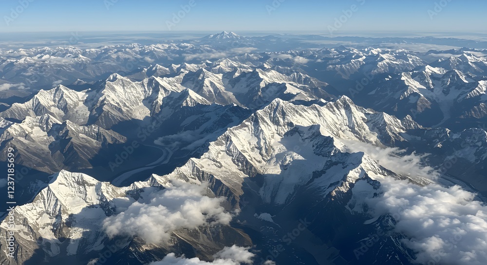 Obraz premium Aerial View of Majestic Snow-covered Mountain Range