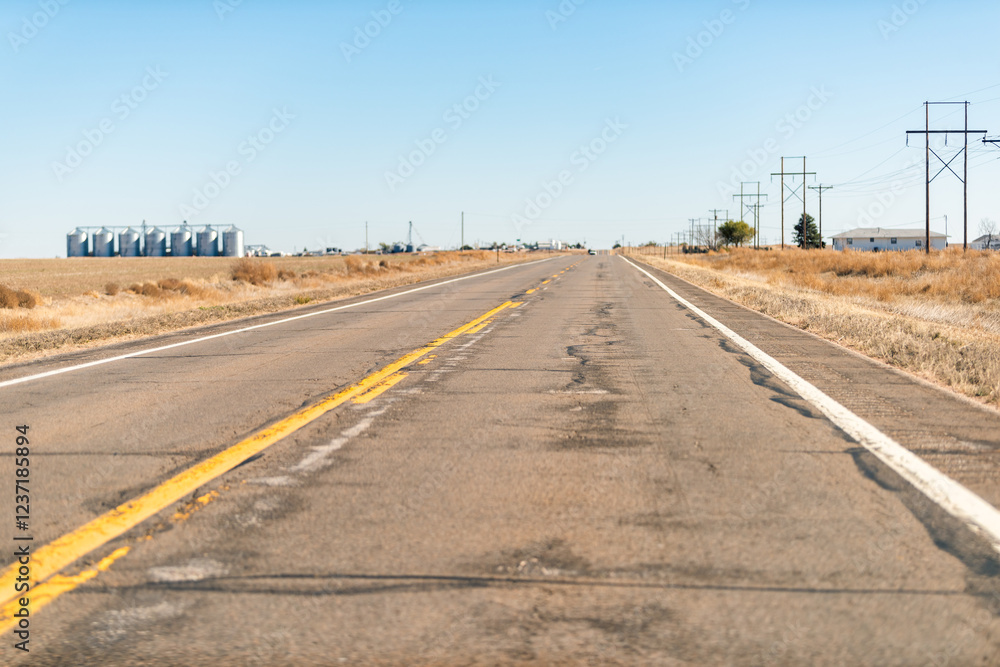 Anton, Colorado on US 36 highway and desert barren landscape blue sky driving car point of view Anton, Colorado on US 36 highway and desert barren landscape blue sky driving car point of view