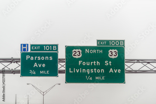 Columbus, Ohio highway 70 road in midwest city with fog mist cloudy day, exit signs for Parsons and Livingston Avenue, Fourth street photo