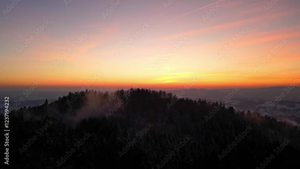 Majestic Winter Sunset Over a Snow-Covered Forest in Blizne, Bathed in a Gentle Mist – A Breathtaking View in Southern Poland Majestic Winter Sunset Over a Snow-Covered Forest in Blizne, Bathed in a Gentle Mist – A Breathtaking View in Southern Poland