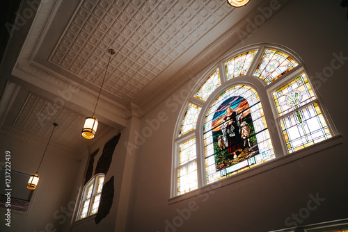 Stained glass of Jesus holding lambs, presbyterian photo