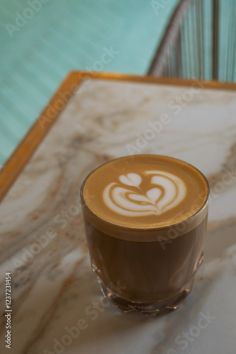 Close-Up of a Latte with Latte Art in a Coffee Shop