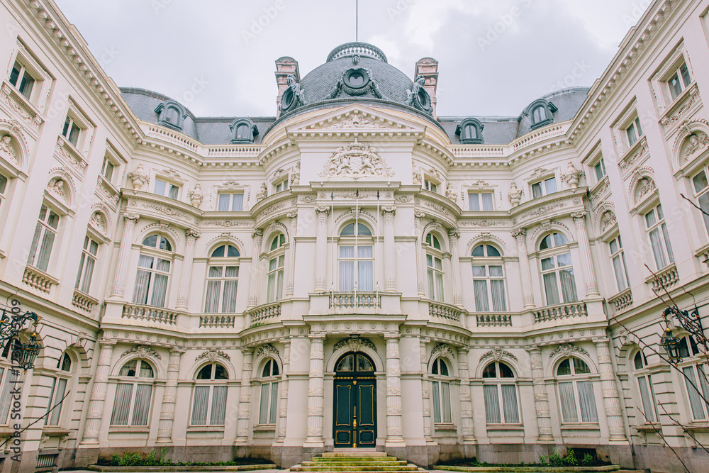 Fototapeta premium Neoclassical Palace in Brussels, Belgium - Ornate Architectural Facade with Symmetrical Windows, Columns, and Elegant Detailing