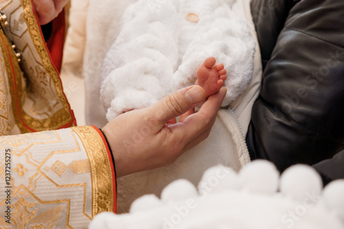 Religious Ceremony with Infant Blessing in Traditional Attire photo