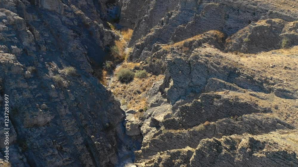 AKTAU, KAZAKHSTAN - FEBRUARY 1, 2025 Exploring the rugged canyon landscape of Akatau with vibrant striations and scenic trails AKTAU, KAZAKHSTAN - FEBRUARY 1, 2025 Exploring the rugged canyon landscape of Akatau with vibrant striations and scenic trails