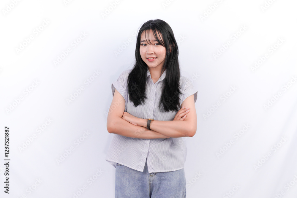 Indonesian Asian woman with long black hair is hugging herself Indonesian Asian woman with long black hair is hugging herself