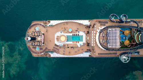 Фотография Aerial view top down of stern upper deck of luxurious cruise ship with swimming