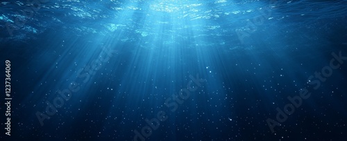 Underwater sunbeams, ocean depth, background particles, serene backdrop
