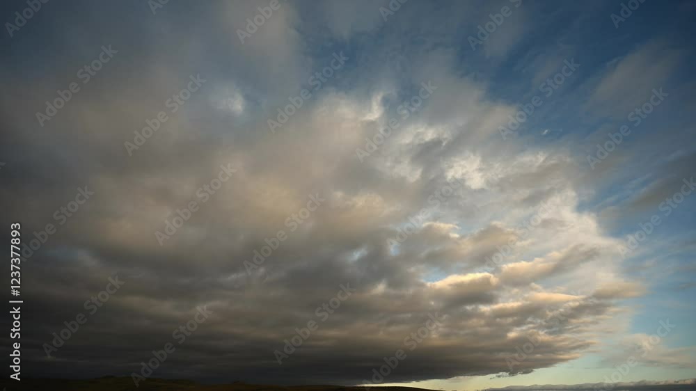Time lapse of late day clouds moving towards the viewer above a prairie park setting
Time lapse of late day clouds moving towards the viewer above a prairie park setting