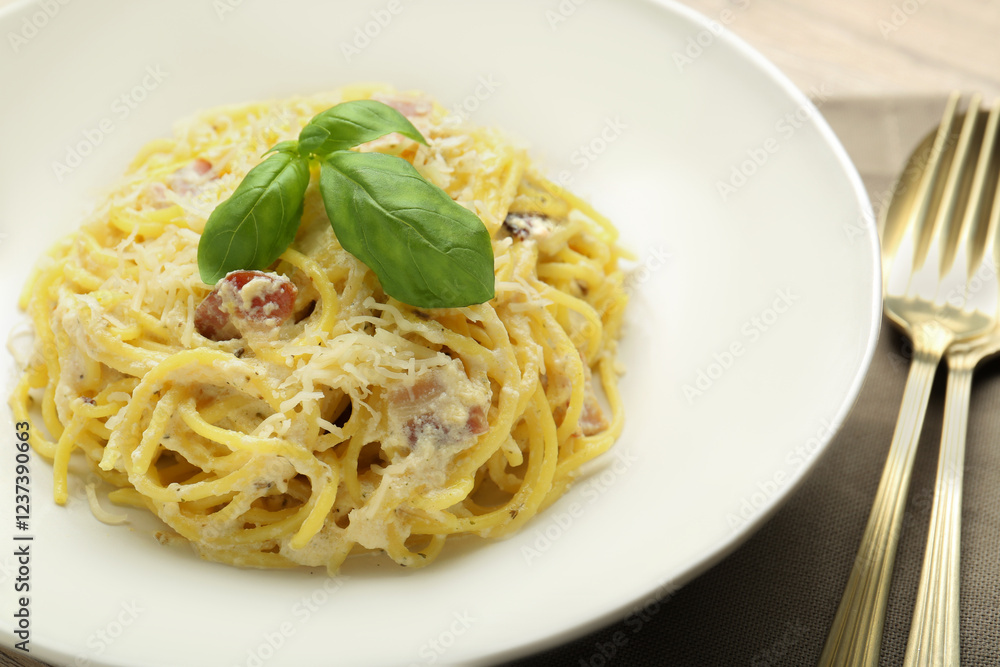 Delicious pasta Carbonara with basil on table, closeup Delicious pasta Carbonara with basil on table, closeup