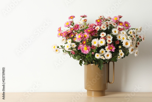 Wallpaper Mural Vase with beautiful flowers on wooden table, space for text Torontodigital.ca